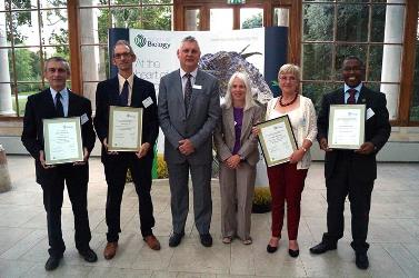 Representatives from the four universities receive accreditation of their bioscience programmes